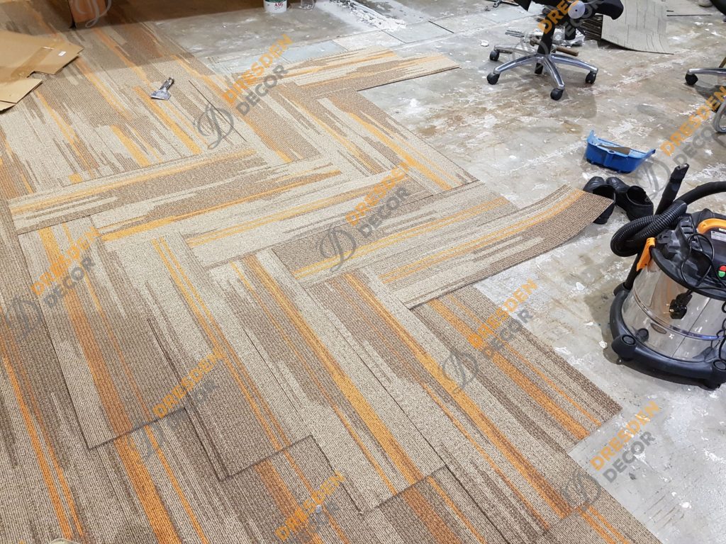 Carpet installation in progress - herringbone style.