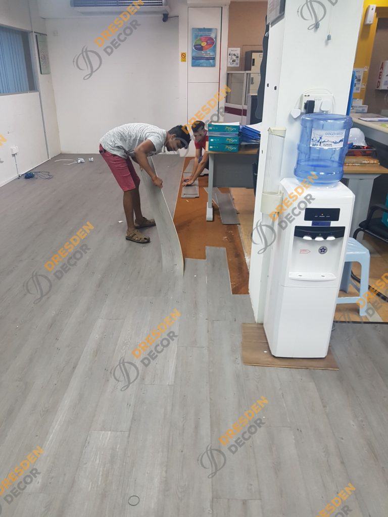 Existing SPC Flooring being removed.