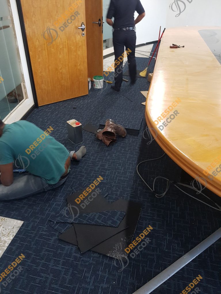 Carpet Tiles installation in progress.