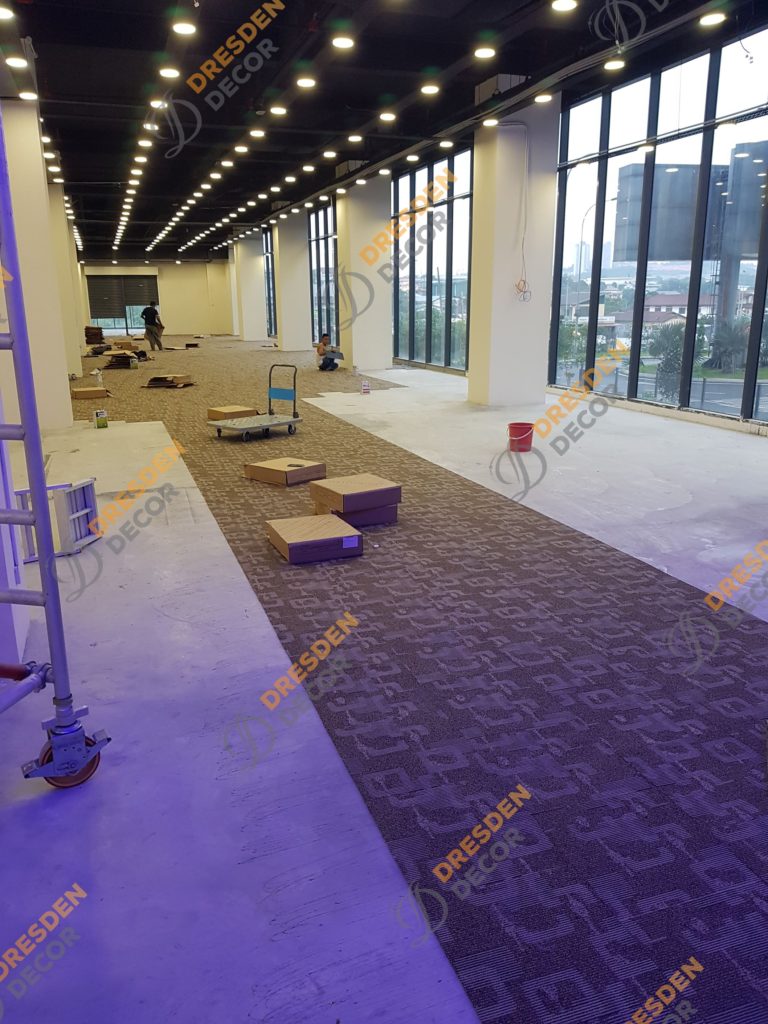 Carpet Tiles installation in progress.