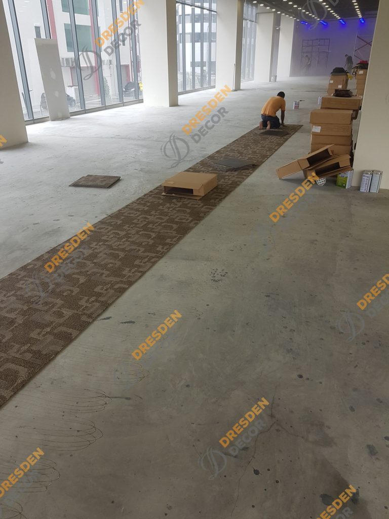 Carpet Tiles installation in progress.