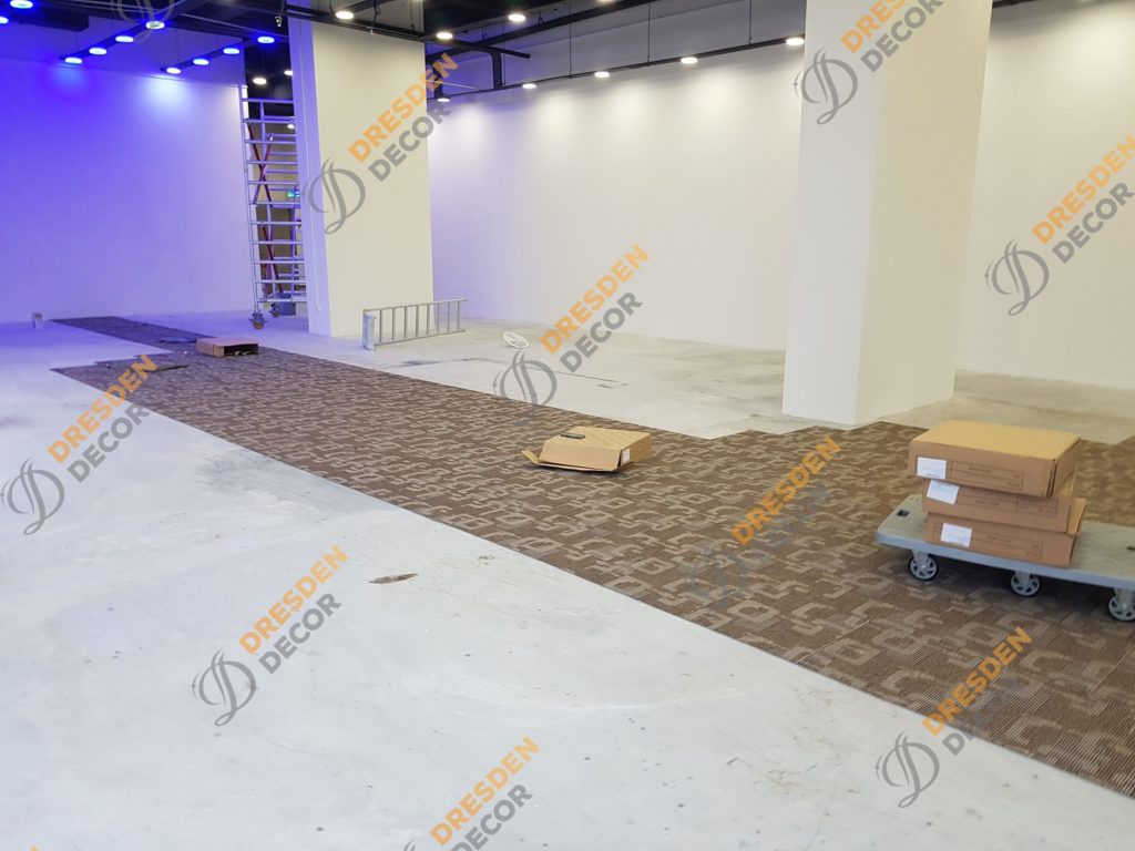 Carpet Tiles installation in progress.