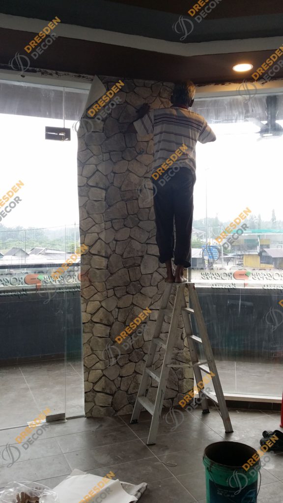 Wallpaper installation in progress.