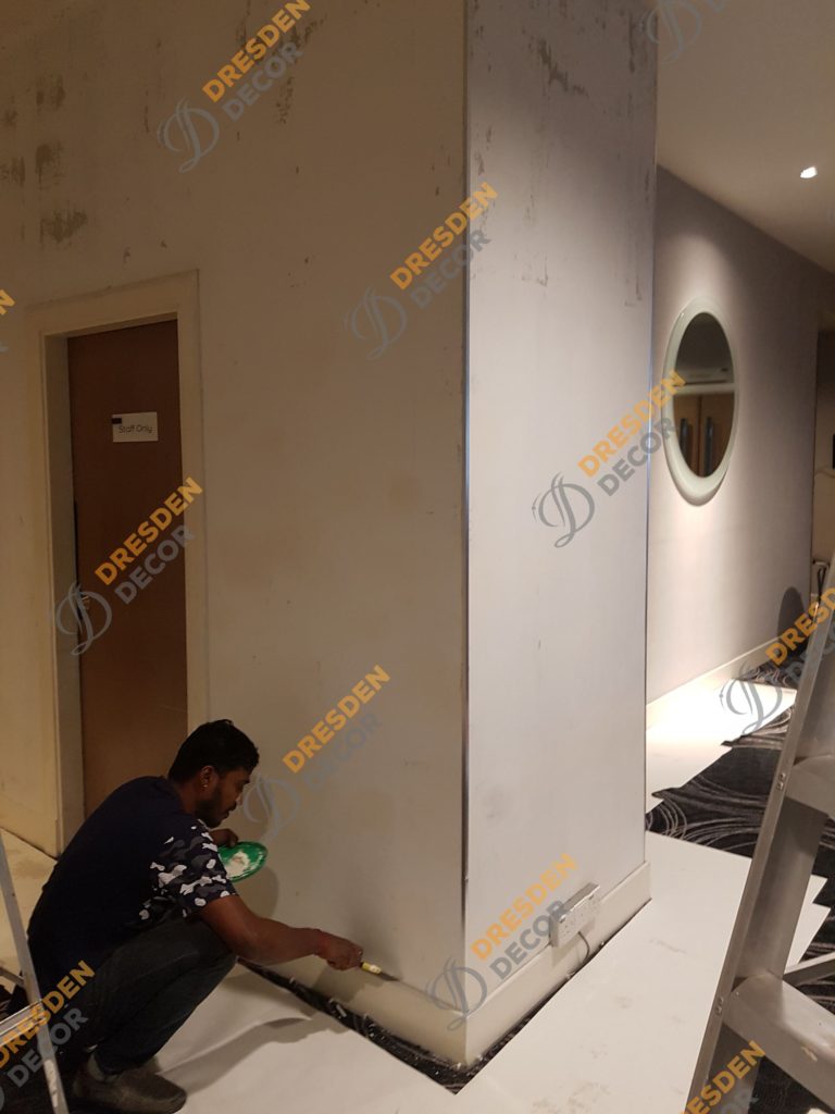 Existing wallpaper removed and wall surface are repaired