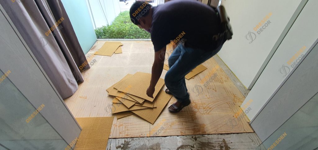 Removal of existing carpet tiles
