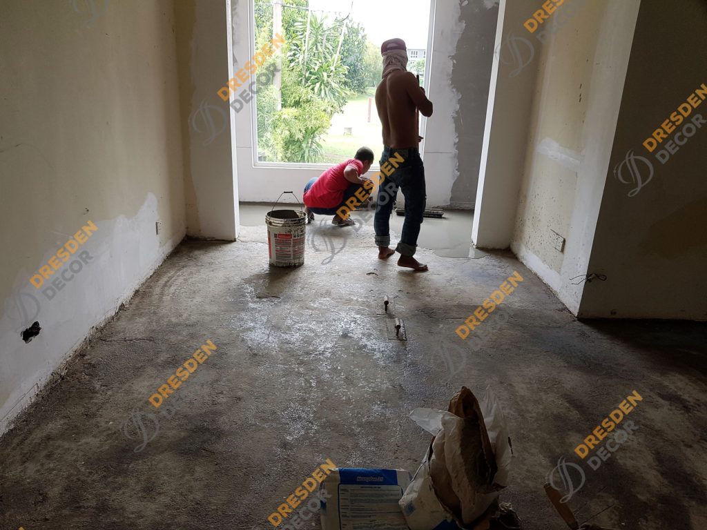 Floor is being cleaned and applied primer